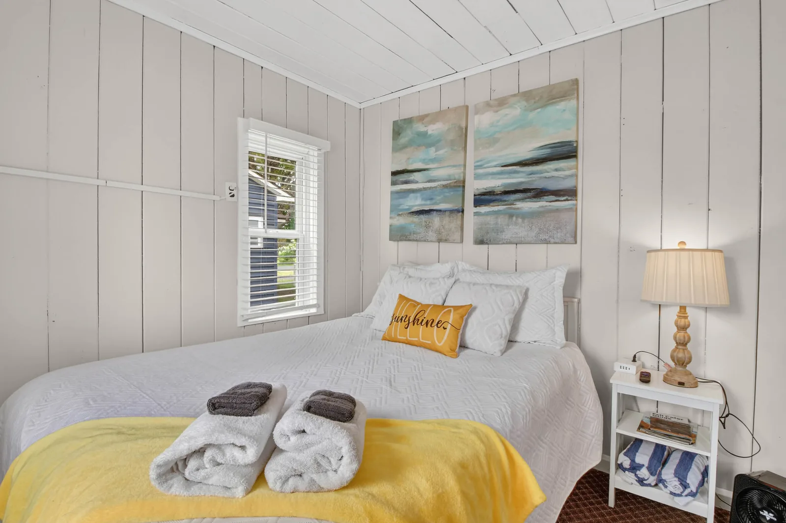 Cabin 9 bedroom with seascape diptych and lamp