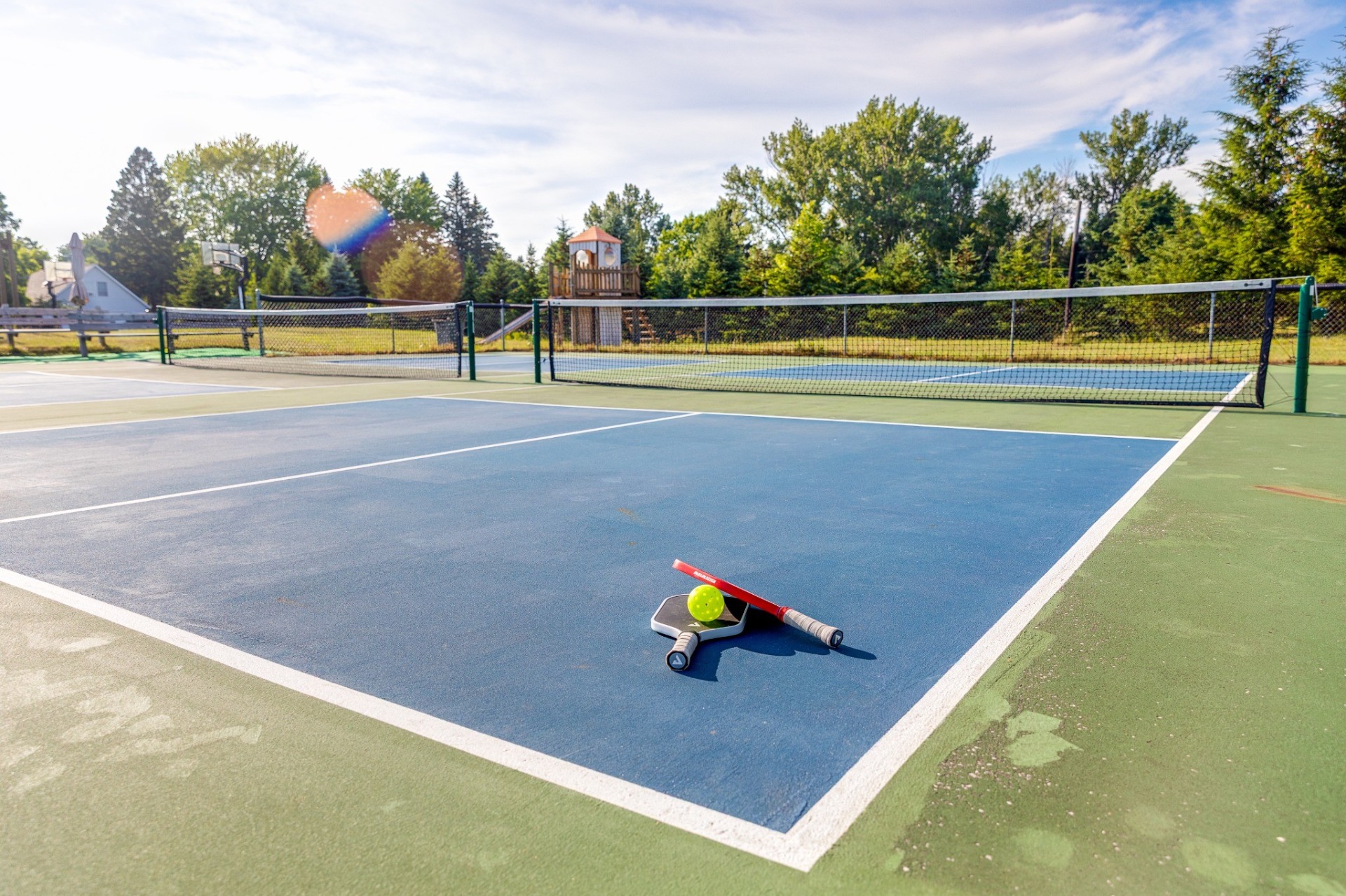 Pickleball court with paddles ready to play
